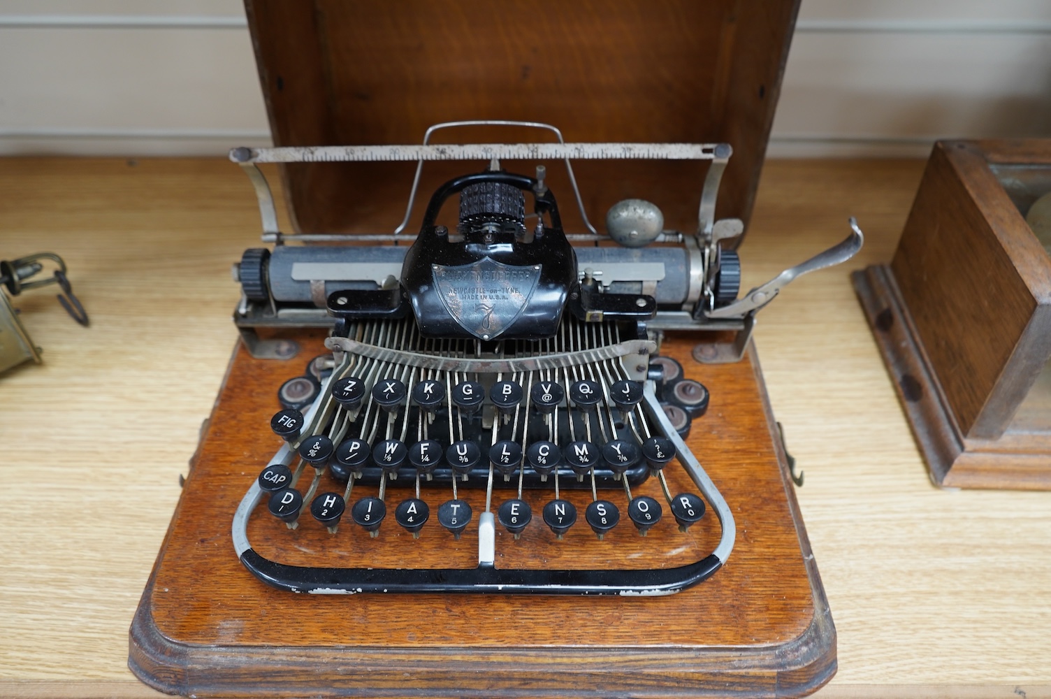 A late 19th century Blickensderfer Newcastle-on-Tyne, manual typewriter, model No.7, in an oak case with oak plywood cover, Made in the USA. Condition - fair to good, the action appears to move smoothly. There are some r